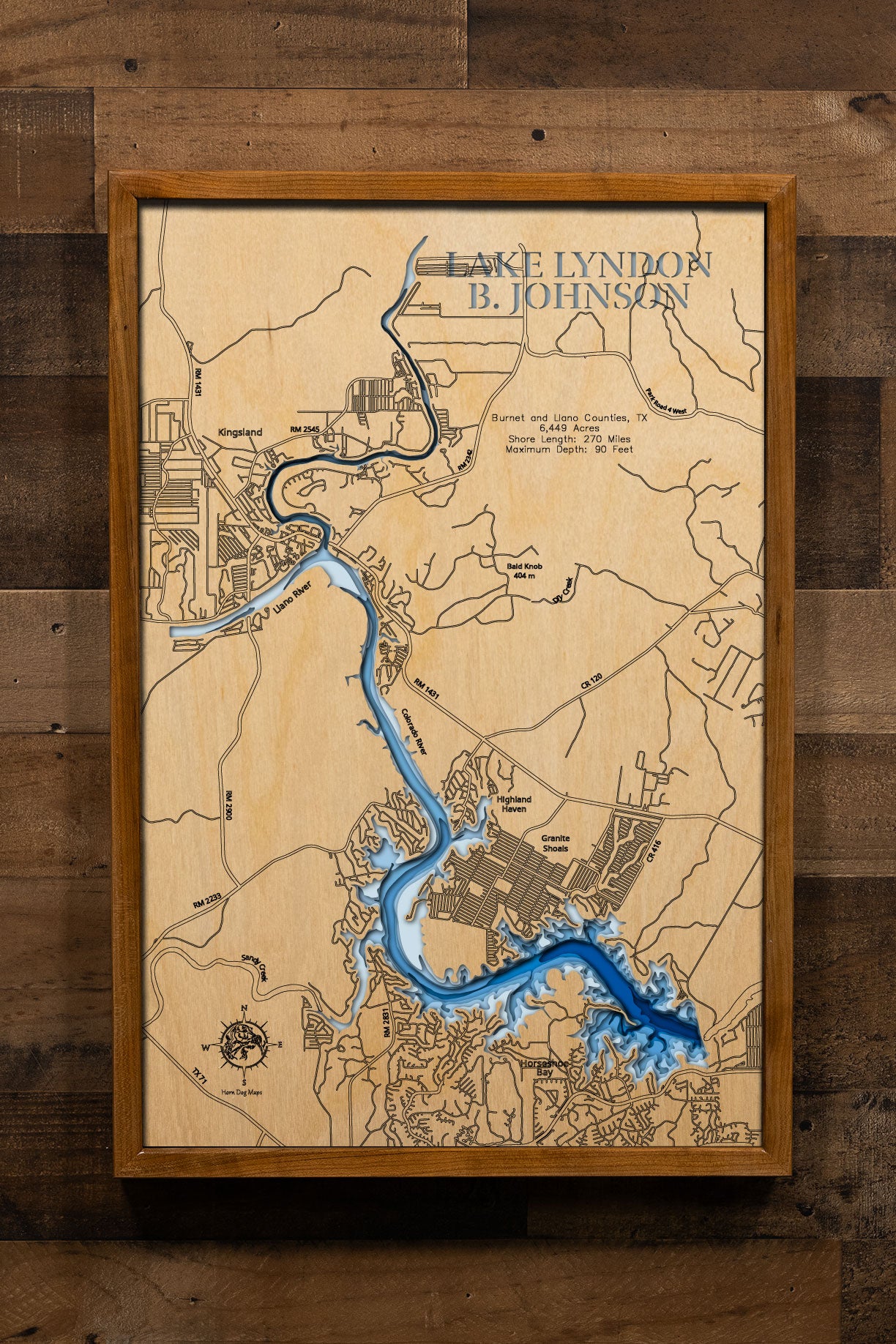 A precision laser-cut, multi-layered wooden map of Lake Lyndon B. Johnson in Burnet and Llano Counties, Texas, a 6,449-acre constant-level Highland Lakes reservoir stretching 21 miles through the Texas Hill Country with 270 miles of shoreline. The natural wood top layer captures every cove and creek arm in fine detail, while a light-to-dark blue gradient conveys the lake's 90-foot depth. A handcrafted statement piece for any Texas Hill Country lake home, cabin, or outdoor enthusiast's wall.