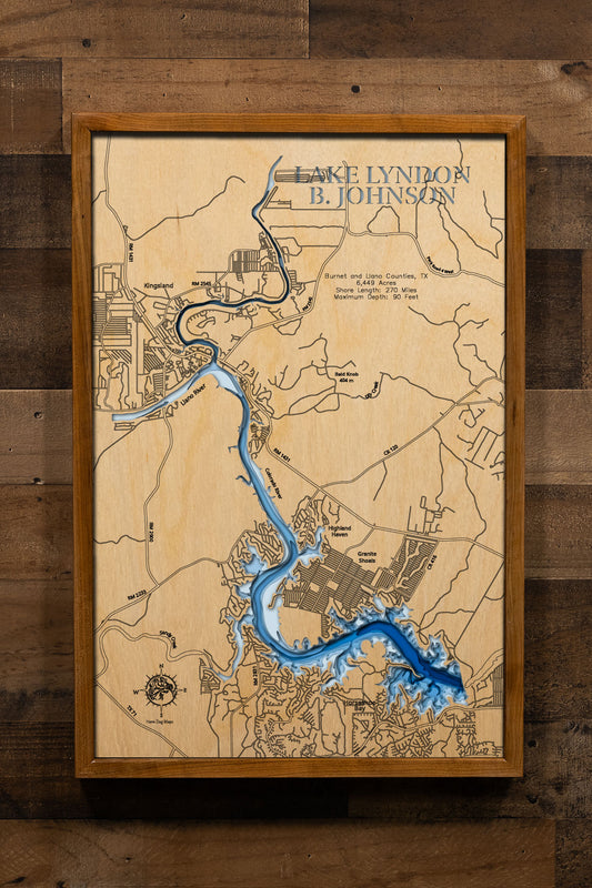 A precision laser-cut, multi-layered wooden map of Lake Lyndon B. Johnson in Burnet and Llano Counties, Texas, a 6,449-acre constant-level Highland Lakes reservoir stretching 21 miles through the Texas Hill Country with 270 miles of shoreline. The natural wood top layer captures every cove and creek arm in fine detail, while a light-to-dark blue gradient conveys the lake's 90-foot depth. A handcrafted statement piece for any Texas Hill Country lake home, cabin, or outdoor enthusiast's wall.