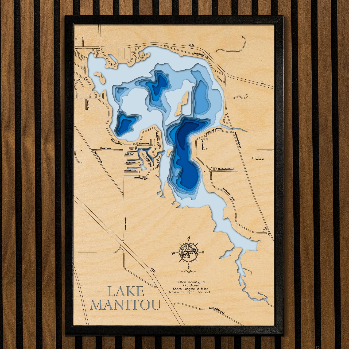 Artisanally carved wooden lake map of Lake Manitou in Fulton County, IN, highlighting bathymetry.