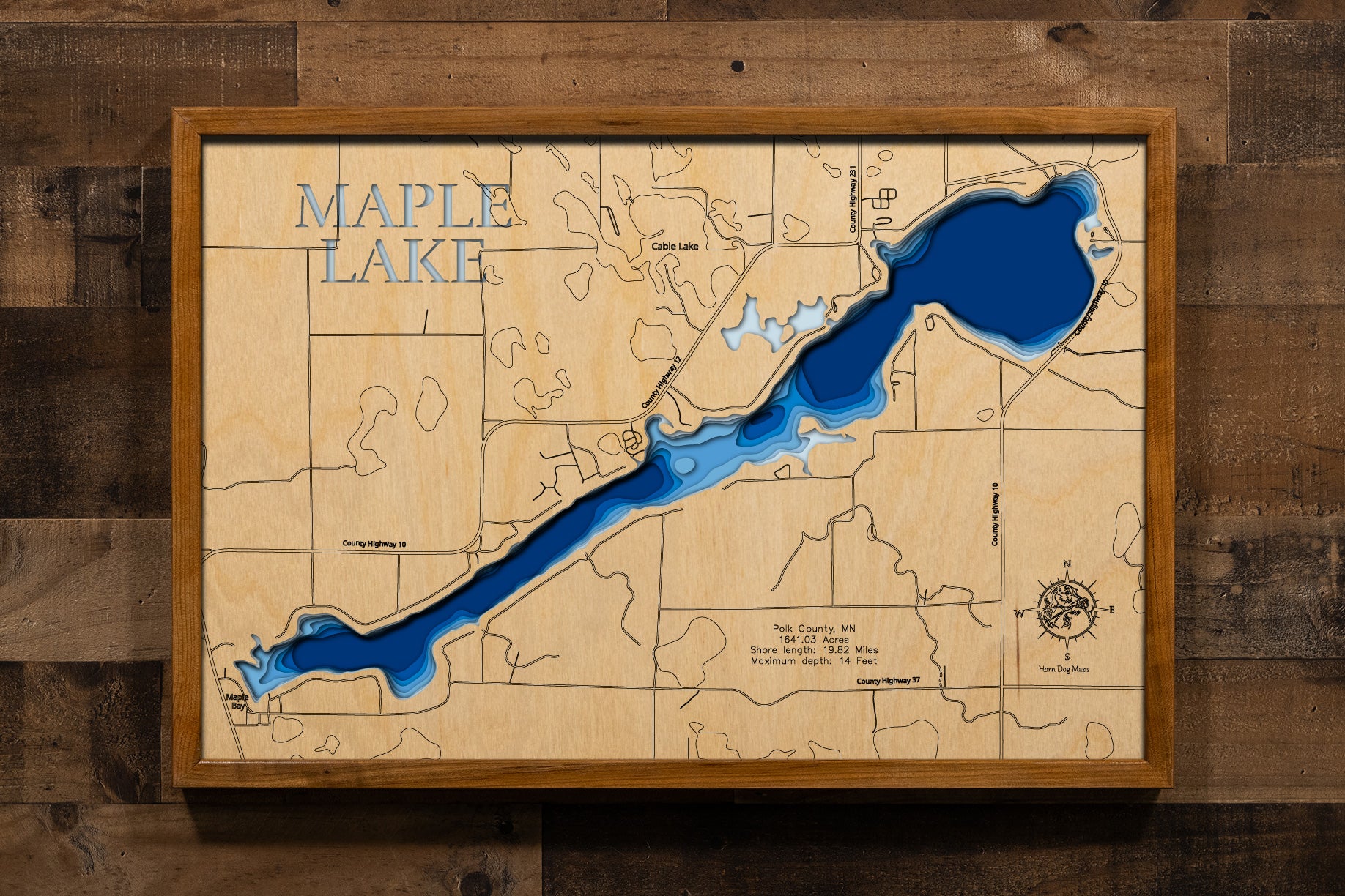 A highly detailed, laser-cut, and multi-layered wooden map of Maple Lake, a natural lake in Polk County, Minnesota. The map shows the lake's distinct shape and its extensive 20.32-mile shoreline. The varying depths of the lake, reaching a maximum of 15 feet, are represented by different layers of wood.