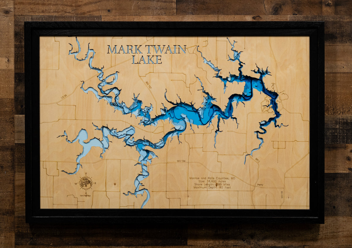 A precision laser-cut, multi-layered wooden map of Mark Twain Lake in Ralls and Monroe Counties, Missouri, an 18,600-acre Salt River reservoir completed in 1984 with 285 miles of undeveloped shoreline near the birthplace of Mark Twain. The natural wood top layer captures every cove and creek arm in fine detail, while a light-to-dark blue gradient conveys the lake's 85-foot depth. A handcrafted statement piece for any Missouri lake home, cabin, or outdoor enthusiast's wall.