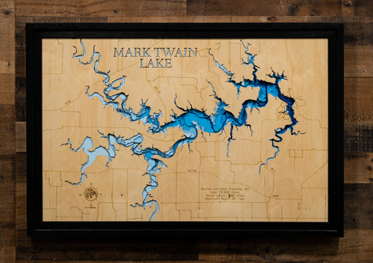 A precision laser-cut, multi-layered wooden map of Mark Twain Lake in Ralls and Monroe Counties, Missouri, an 18,600-acre Salt River reservoir completed in 1984 with 285 miles of undeveloped shoreline near the birthplace of Mark Twain. The natural wood top layer captures every cove and creek arm in fine detail, while a light-to-dark blue gradient conveys the lake's 85-foot depth. A handcrafted statement piece for any Missouri lake home, cabin, or outdoor enthusiast's wall.