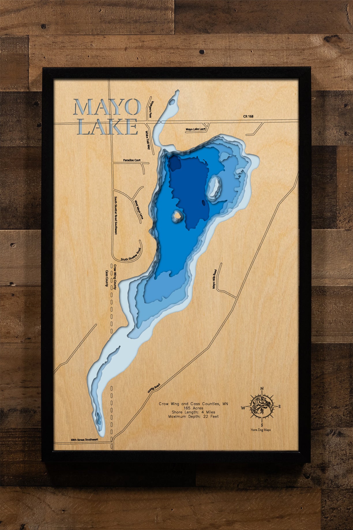 A highly detailed, laser-cut, and multi-layered wooden map of Mayo Lake in Crow Wing County, Minnesota. The map showcases the lake's compact 165-acre surface with shallow depth contours averaging 15 feet and reaching a maximum of 22 feet, emergent vegetation along shorelines, and 4 miles of peaceful shoreline surrounded by protected nature preserve.