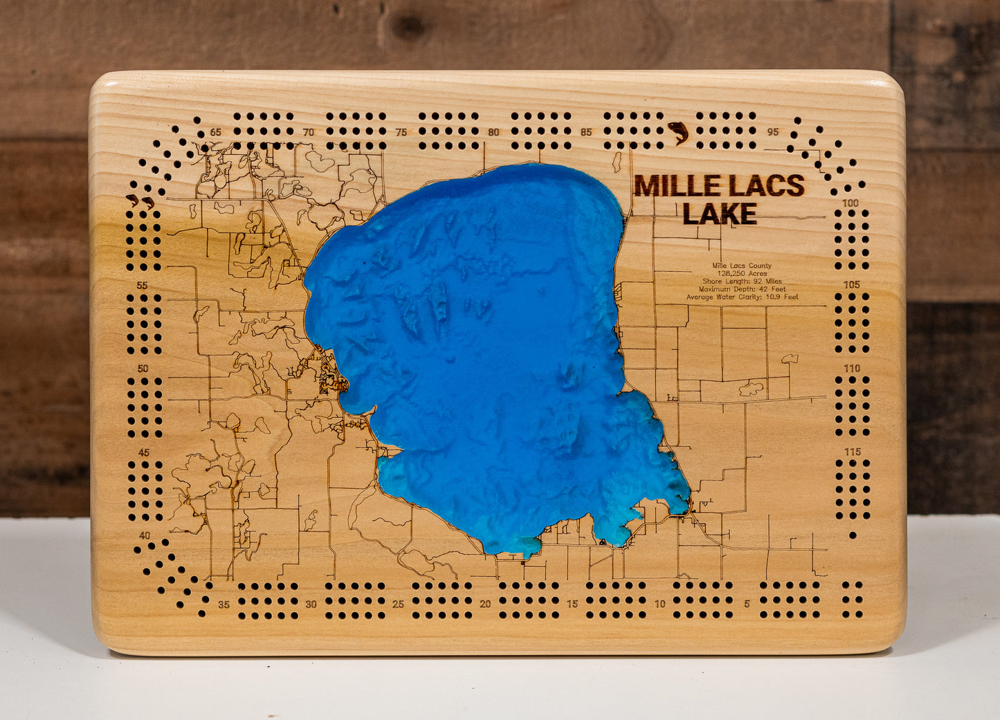 Custom wooden Cribbage Board of Mille Lacs Lake in Mille Lacs County, MN with layered depth highlights.
