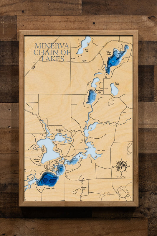 A laser-cut, layered wooden map of the Minerva Chain of Lakes in Burnett County, Wisconsin. The interconnected shapes of the individual lakes within the chain are clearly visible, showcasing their unique forms and the channels that link them. The varying depths of the lakes are represented by different layers of wood, creating a three-dimensional effect of this scenic Wisconsin lake system nestled within Burnett County.
