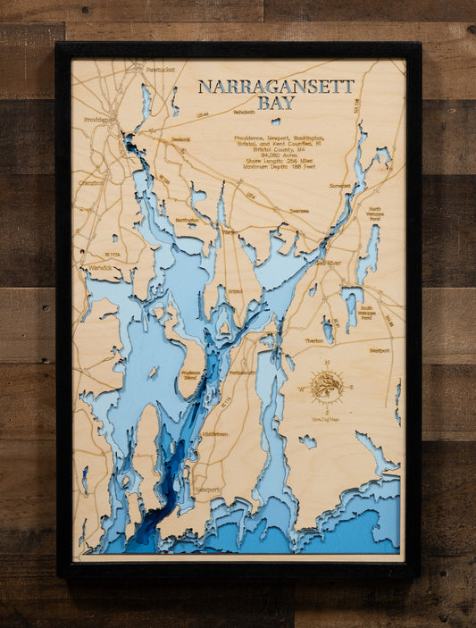 An expertly crafted laser-cut wooden map of Narragansett Bay, New England's largest estuary, showcasing the 147-square-mile bay spanning Rhode Island and Massachusetts, over 30 islands including Aquidneck, Conanicut, and Prudence, 256 miles of intricate shoreline, three distinct passages (West, East, and Sakonnet River), and layered depth contours revealing the 188-foot maximum depth.