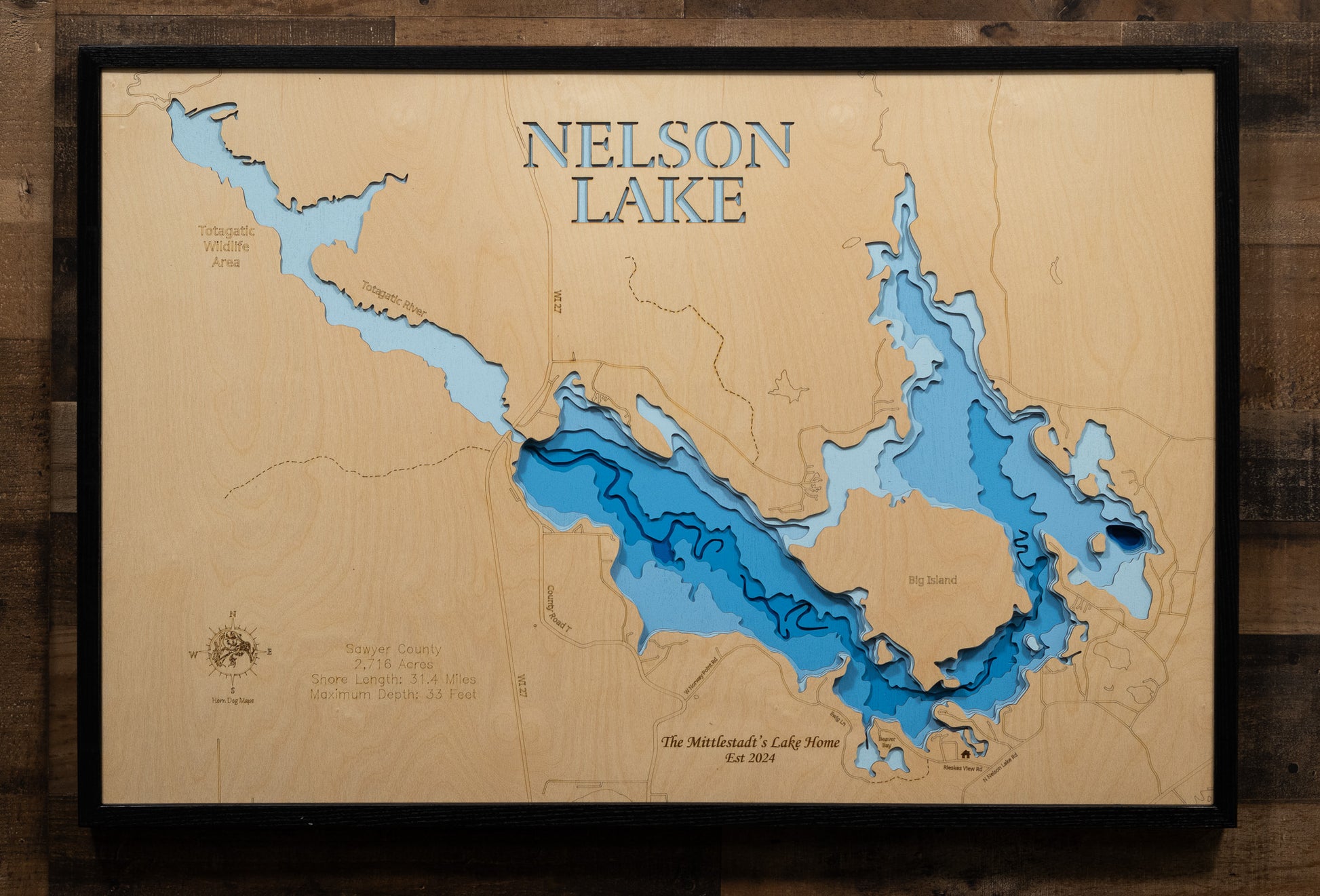 Laser-engraved relief map of Nelson Lake in Sawyer County, WI, crafted from wood with high precision.