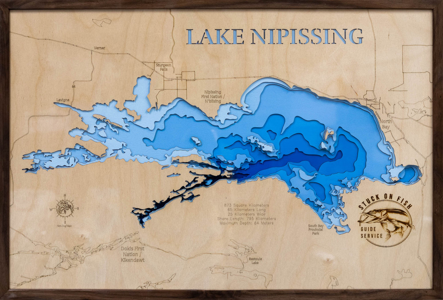 Laser-engraved relief map of Lake Nipissing in Ontario Canada, crafted from wood with high precision.