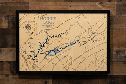 An intricately laser-cut, multi-layered wooden bathymetric map of Norris Lake spanning five Tennessee counties. The detailed three-dimensional relief showcases the 33,840-acre reservoir's impressive 809 miles of winding shoreline through Appalachian valleys, depth contours plunging to the remarkable 210-foot maximum depth near Norris Dam, the convergence of the 73-mile Clinch River and 56-mile Powell River arms, and over 50 islands.