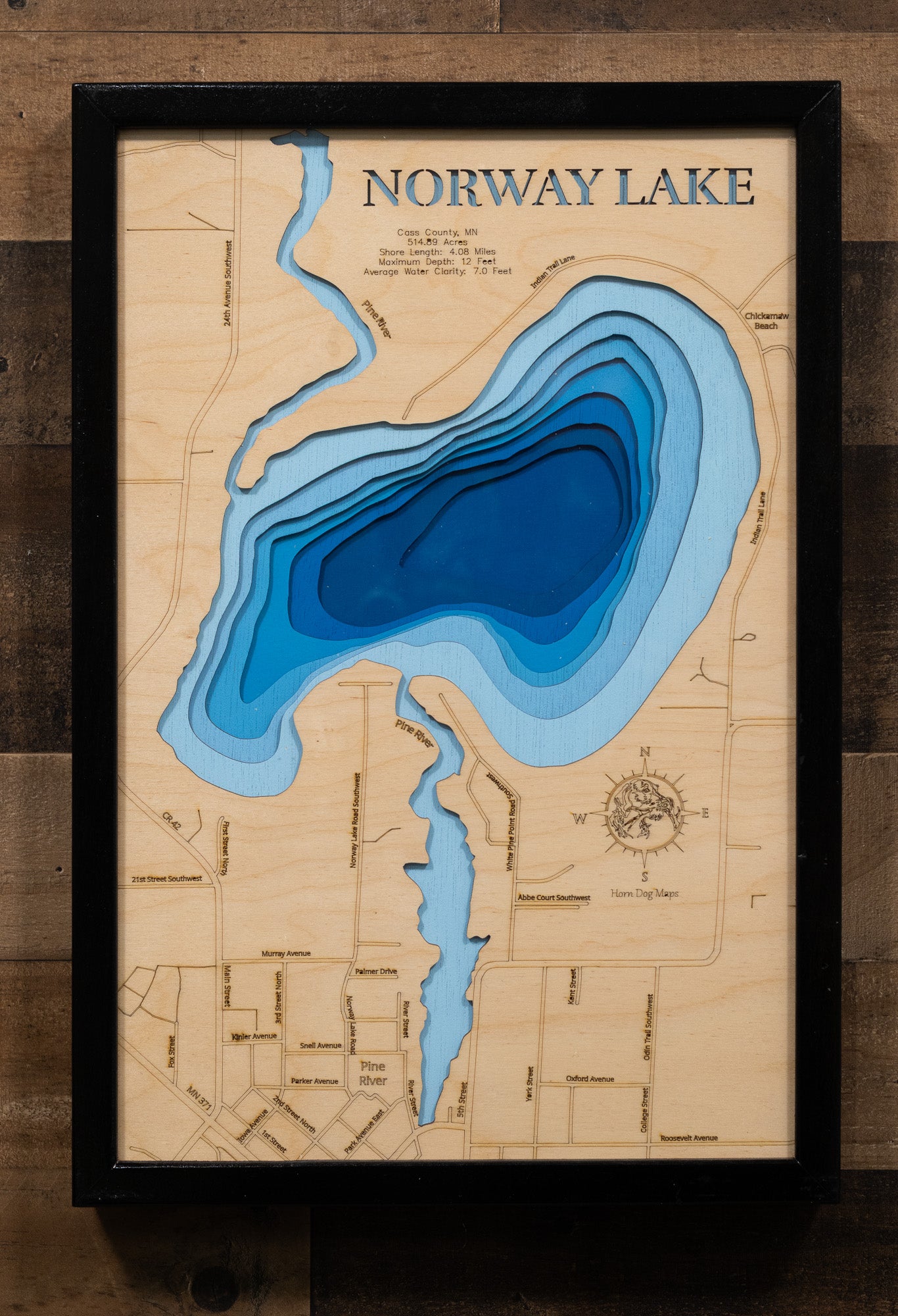 Laser-engraved relief map of Norway Lake in Cass County, MN, crafted from wood with high precision.