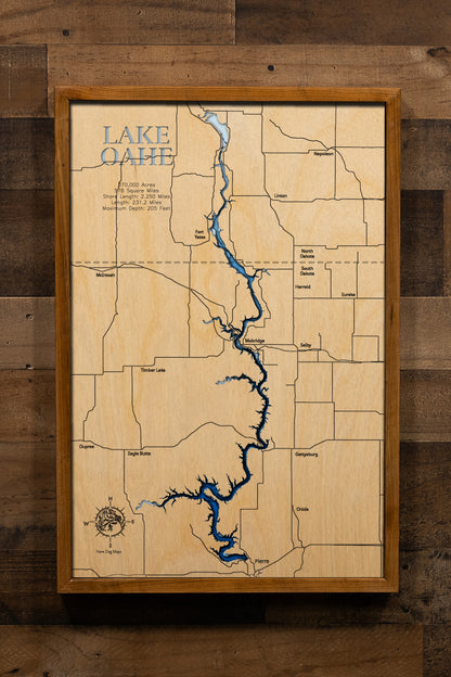 A highly detailed, laser-cut, and multi-layered wooden map of Lake Oahe spanning South Dakota and North Dakota. The map illustrates the reservoir's impressive 231-mile length along the Missouri River, with depth contours showing the 205-foot maximum depth, and the intricate 2,250 miles of meandering shoreline across 14 counties.