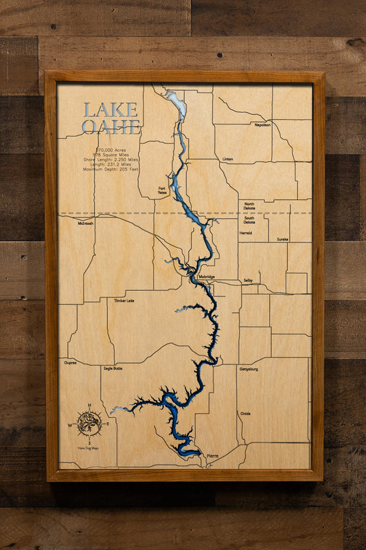 A highly detailed, laser-cut, and multi-layered wooden map of Lake Oahe spanning South Dakota and North Dakota. The map illustrates the reservoir's impressive 231-mile length along the Missouri River, with depth contours showing the 205-foot maximum depth, and the intricate 2,250 miles of meandering shoreline across 14 counties.
