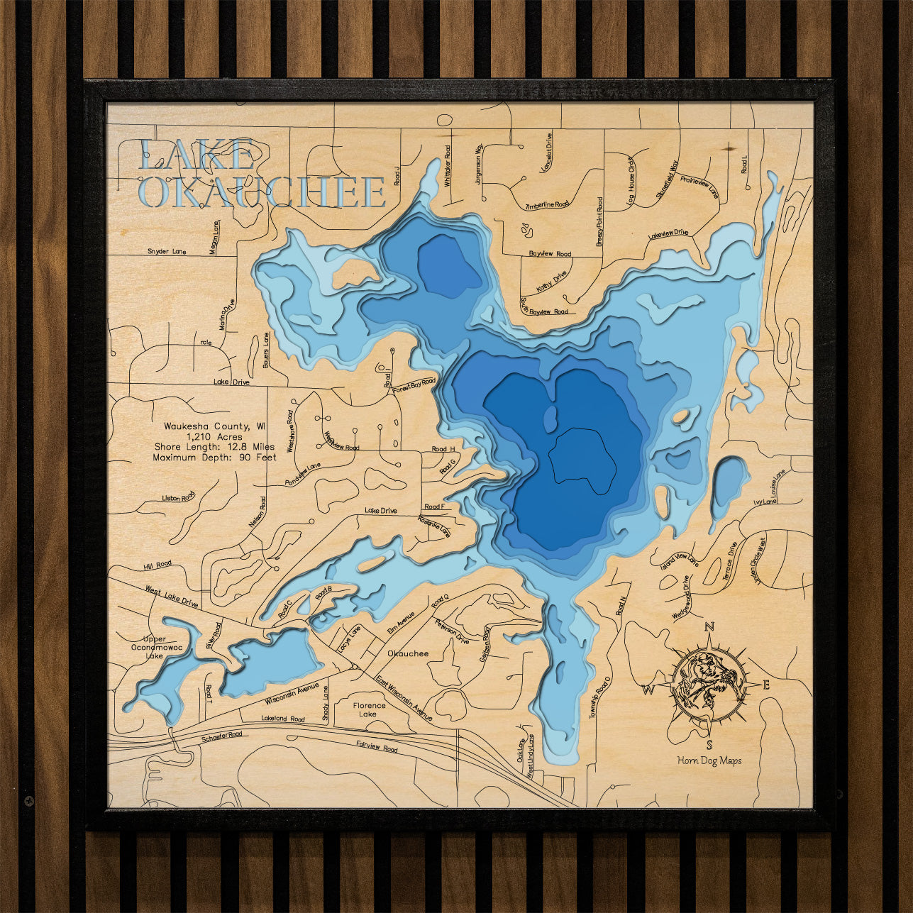 Custom wooden map of Lake Okauchee in Wakesha County, WI with layered depth highlights.