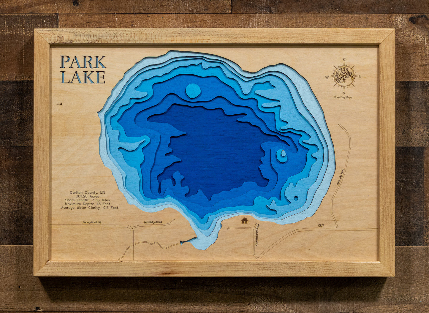 A laser-cut, layered wood map of Park Lake, Carlton County, Minnesota, highlighting its shoreline and surrounding features.
