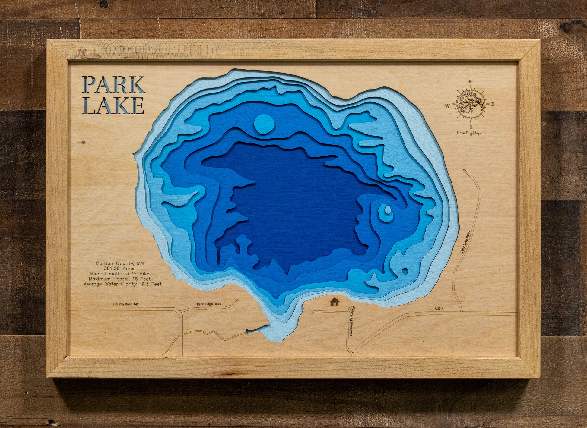 A laser-cut, layered wood map of Park Lake, Carlton County, Minnesota, highlighting its shoreline and surrounding features.