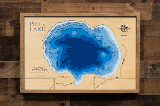A laser-cut, layered wood map of Park Lake, Carlton County, Minnesota, highlighting its shoreline and surrounding features.
