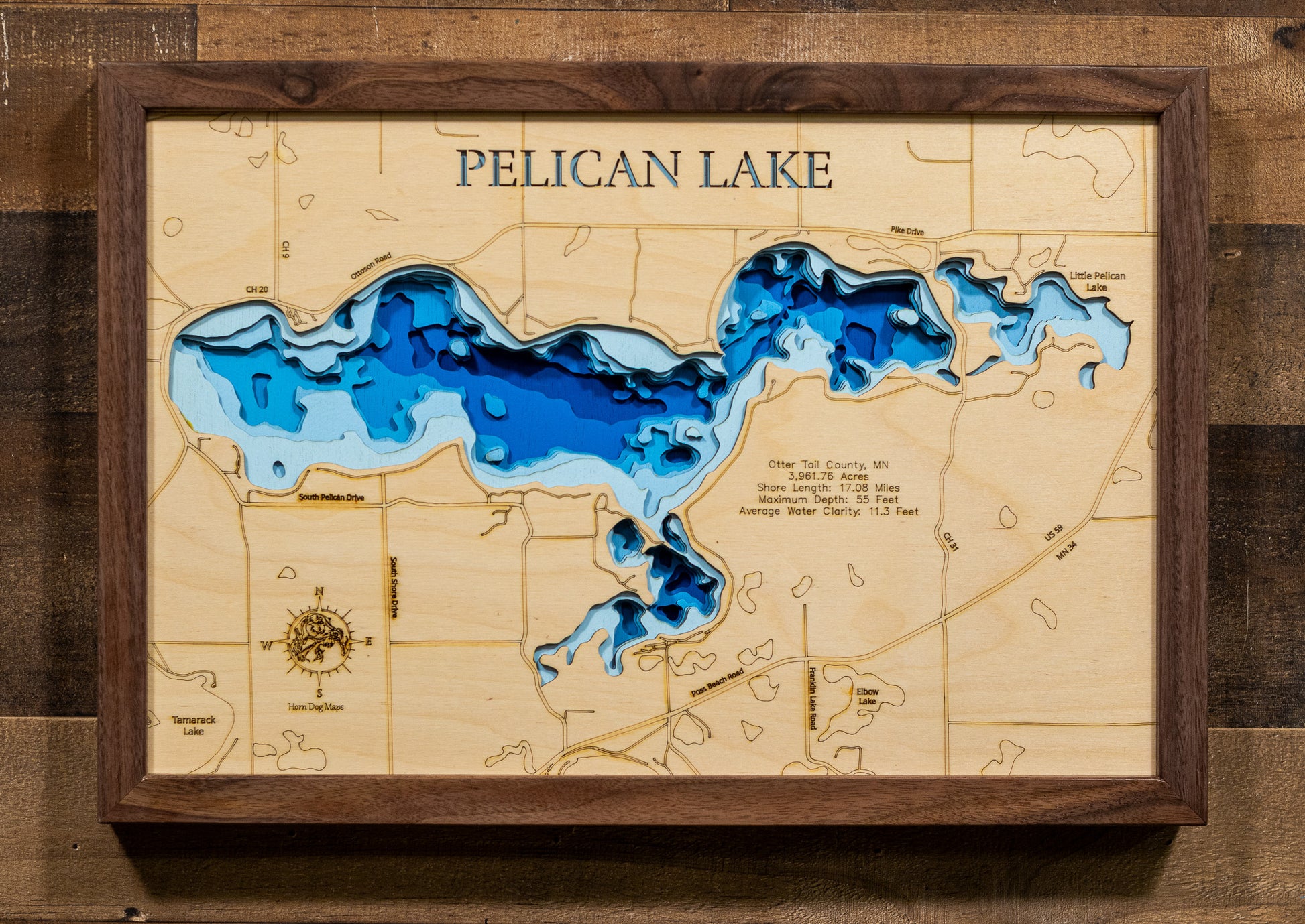Artisanally carved wooden lake map of Pelican Lake in Otter Tail County, MN, highlighting bathymetry.
