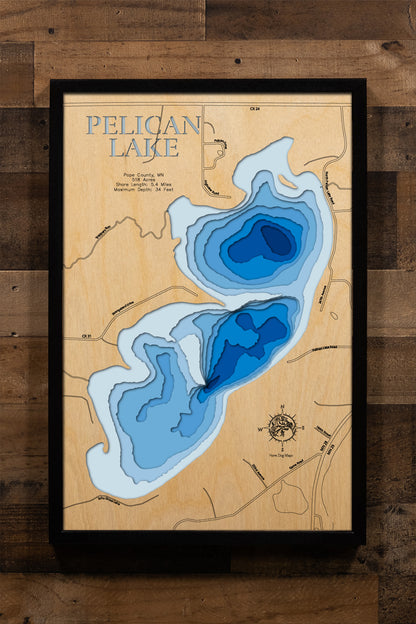 A handcrafted, 3D laser-cut wooden map of Pelican Lake near 
Glenwood, Minnesota. The map features a beautiful natural wood top 
layer that highlights the intricate shoreline and surrounding Pope 
County terrain. The lake's depth is artfully represented by multi-
layered wood stained in a light-to-dark blue gradient. This 
stunning topographic art piece is designed for sophisticated cabin 
decor and home interiors, measuring with high precision.