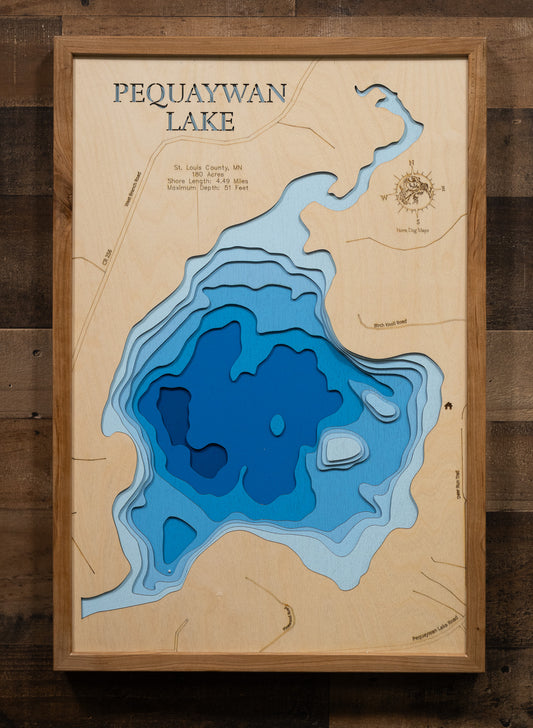 A laser-cut, layered wooden map of Smith Lake (Little Pequaywan) in St. Louis County, Minnesota. The distinct shape of this natural lake, with its 4.49-mile shoreline, is clearly visible within the forested landscape of northeastern Minnesota. The varying depths of the lake, reaching a maximum of 51 feet, are represented by different layers of wood, illustrating its impressive underwater topography.
