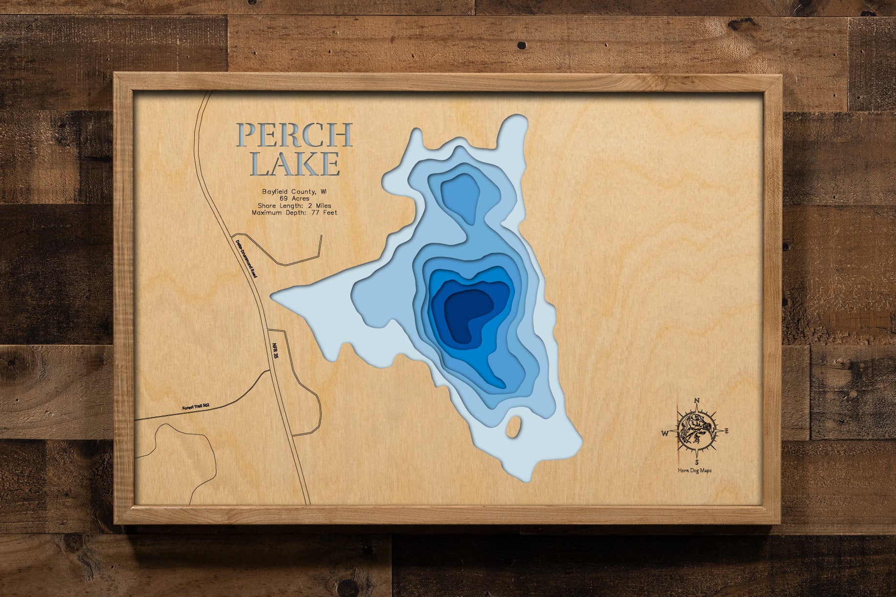 A meticulously detailed, laser-cut, multi-layered wooden topographical map of Perch Lake in Bayfield County, Wisconsin, showcasing the 69-acre lake depth. 
