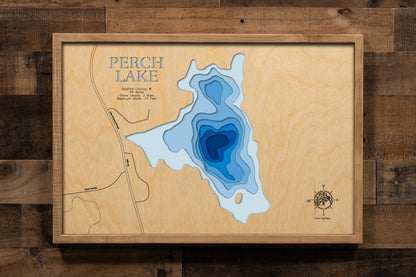 A meticulously detailed, laser-cut, multi-layered wooden topographical map of Perch Lake in Bayfield County, Wisconsin, showcasing the 69-acre lake depth. 