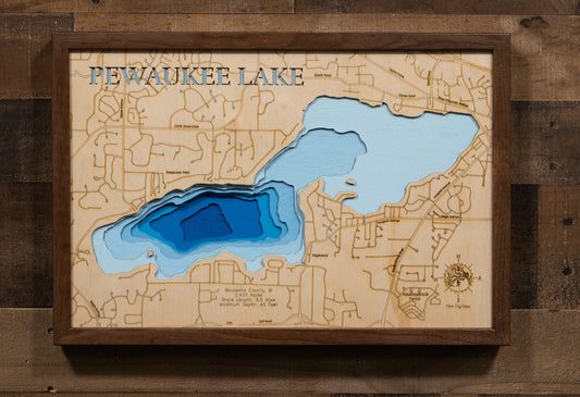 Laser-engraved relief map of Pewaukee Lake in Waukesha County, WI, crafted from wood with high precision.