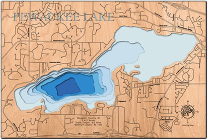 Laser-engraved relief map of Pewaukee Lake in Waukesha County, WI, crafted from wood with high precision.