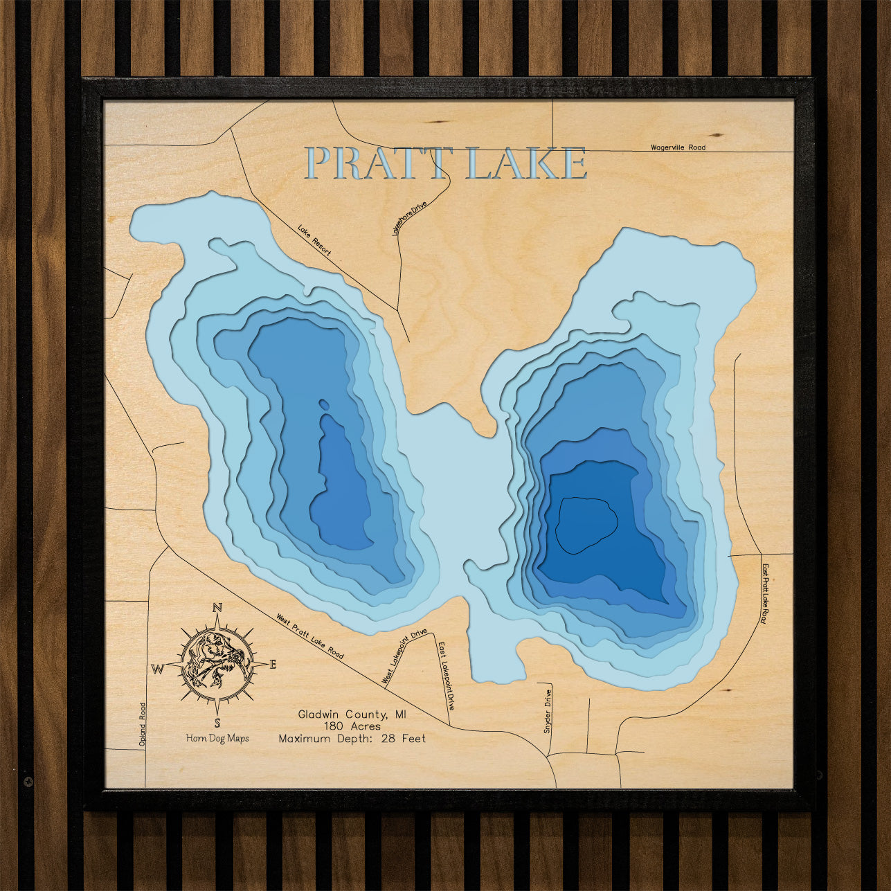 Laser-engraved relief map of Pratt Lake in Gladwin County, MI, crafted from wood with high precision.