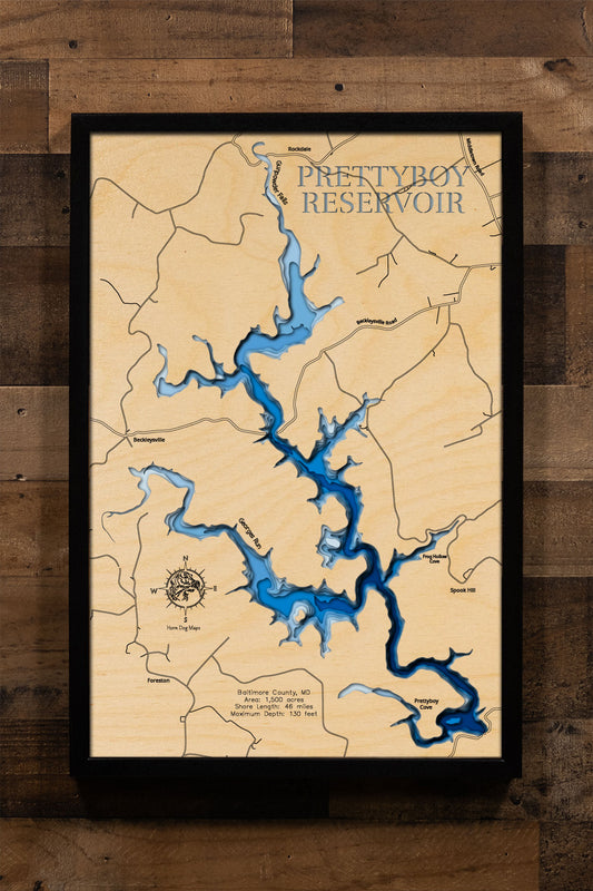 A laser-cut, layered wood map of Prettyboy Reservoir, Maryland, highlighting its winding shoreline and forested surroundings in Baltimore County.