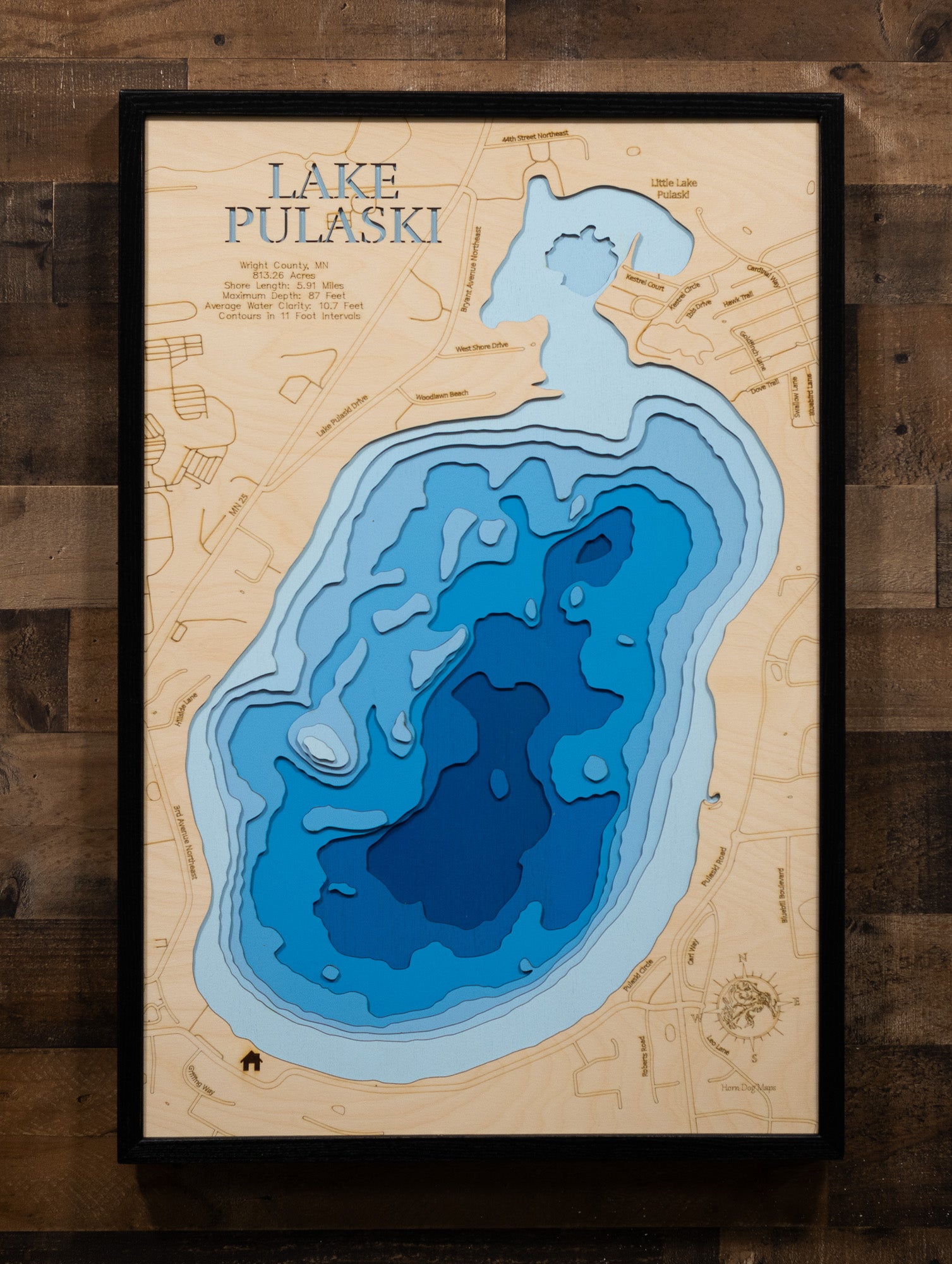 Laser-engraved relief map of Lake Pulaski in Wright County, MN, crafted from wood with high precision.
