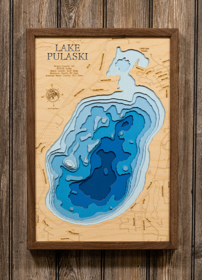 Laser-engraved relief map of Lake Pulaski in Wright County, MN, crafted from wood with high precision.