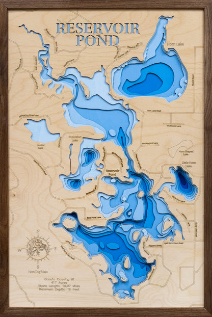 Laser-engraved relief map of Reservoir Pond in Oconto County, WI, crafted from wood with high precision.