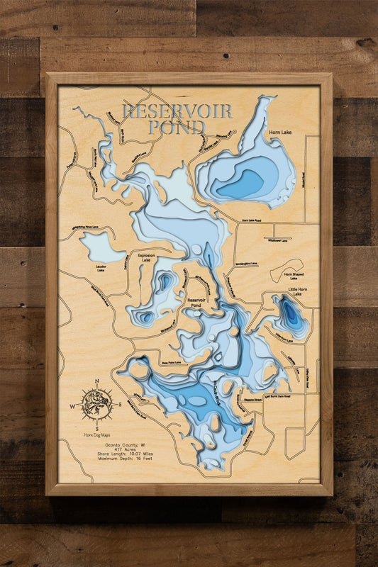 Laser-engraved relief map of Reservoir Pond in Oconto County, WI, crafted from wood with high precision.