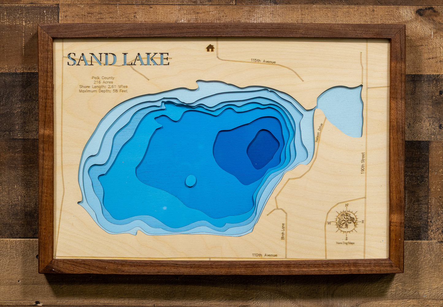 Custom wooden map of Big Sand Lake in Burnett County, Wisconsin with layered depth highlights.
