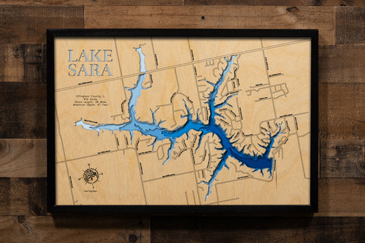 A precision laser-cut, multi-layered wooden map of Lake Sara in Effingham County, Illinois, a 614-acre community reservoir near Effingham with 38 miles of wooded shoreline and a maximum depth of 47 feet. The natural wood top layer captures every winding cove in fine detail, while a light-to-dark blue gradient conveys the lake's depth and wooded character. A handcrafted statement piece for any Illinois lake home, cabin, or outdoor enthusiast's wall.