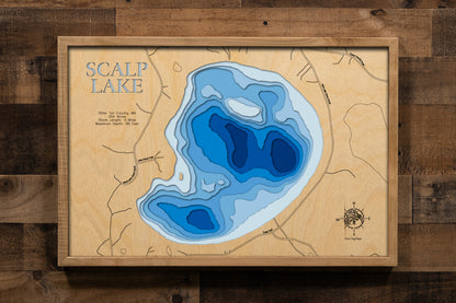 A meticulously detailed, laser-cut, multi-layered wooden topographical map of Scalp Lake in Otter Tail County, Minnesota, showcasing the 254-acre lake's surface with dramatic depth contours illustrating the transition from shallower areas to the impressive 90-foot maximum depth. The natural wood top layer frames three miles of shoreline with the public boat launch, while graduated blue layers create a striking visual depth gradient.