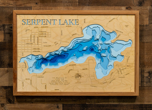 A framed wooden topographic map of Serpent Lake, featuring layered blue contour lines representing the lake depths and a light natural wood background with engraved street details and the text 'SERPENT LAKE' at the top.