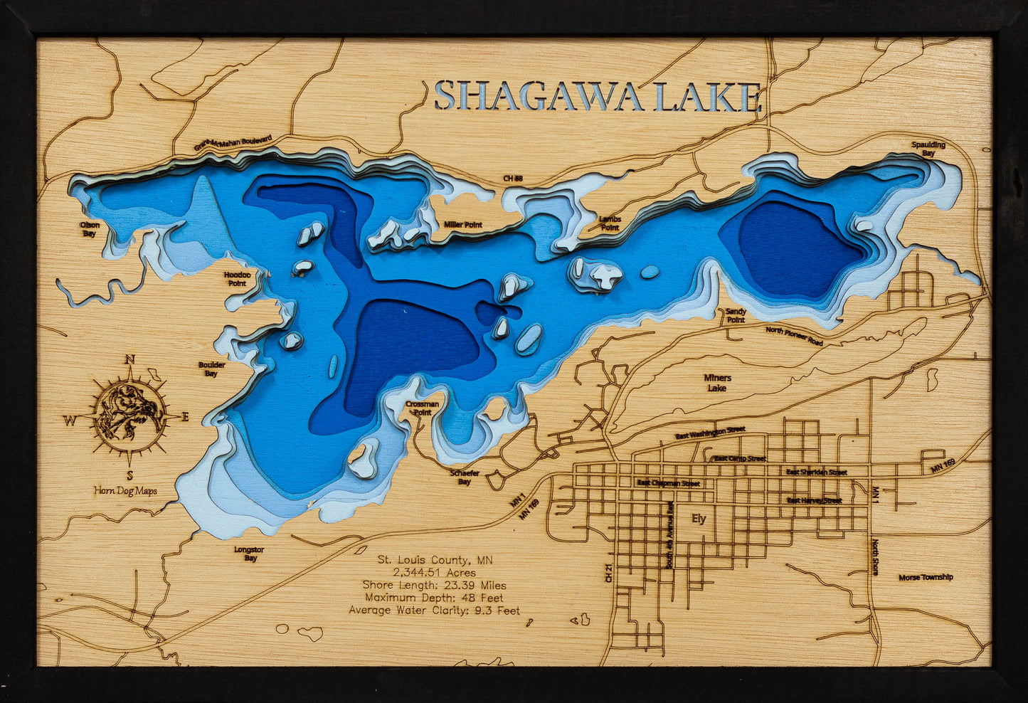 Laser-engraved relief map of Shagawa Lake in St. Louis County, MN, crafted from wood with high precision.