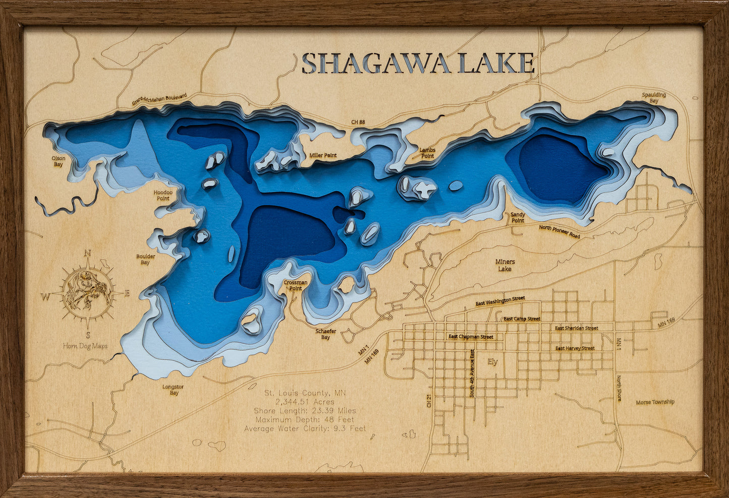 Laser-engraved relief map of Shagawa Lake in St. Louis County, MN, crafted from wood with high precision.