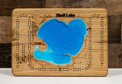 Artisanally carved wooden cribbage board of Shell Lake in Washburn County, WI, highlighting bathymetry.