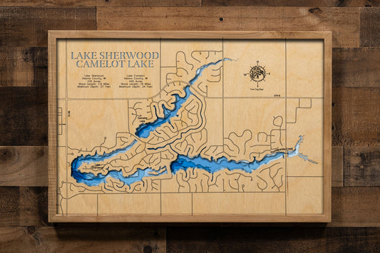 A precision laser-cut, multi-layered wooden map of Lake Camelot and Lake Sherwood in Adams County, Wisconsin, a connected pair of all-sports lakes covering 661 combined acres in the Town of Rome along Fourteen Mile Creek. The natural wood top layer captures both shorelines and their connecting dam in fine detail, while a light-to-dark blue gradient conveys their sandy, shallow character. A handcrafted statement piece for any Wisconsin lake home, cabin, or outdoor enthusiast's wall.