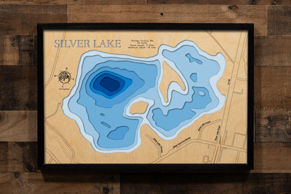 A precision laser-cut, multi-layered wooden map of Silver Lake in Ramsey County, Minnesota, a 76-acre urban lake shared by New Brighton, Maplewood, and North St. Paul in the northeastern Twin Cities metro. The natural wood top layer captures 2 miles of shoreline in fine detail, while a light-to-dark blue gradient conveys the lake's 18-foot depth. A handcrafted statement piece for any Minnesota lake home, Twin Cities cabin, or outdoor enthusiast's wall.