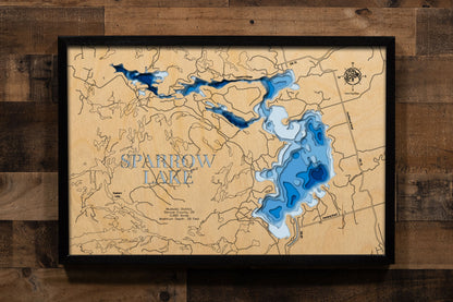 A precision laser-cut, multi-layered wooden map of Sparrow Lake in Muskoka District and Simcoe County, Ontario, a 2,992-acre Trent-Severn Waterway lake and the most southerly lake in Muskoka cottage country. The natural wood top layer captures every granite island and rocky cove in fine detail, while a light-to-dark blue gradient conveys the lake's 39-foot depth. A handcrafted statement piece for any Ontario cottage, Muskoka retreat, or Canadian Shield enthusiast's wall.
