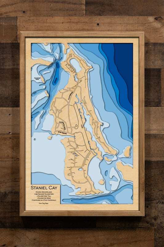 Artisanally carved wooden map of Staniel Cay, highlighting bathymetry.