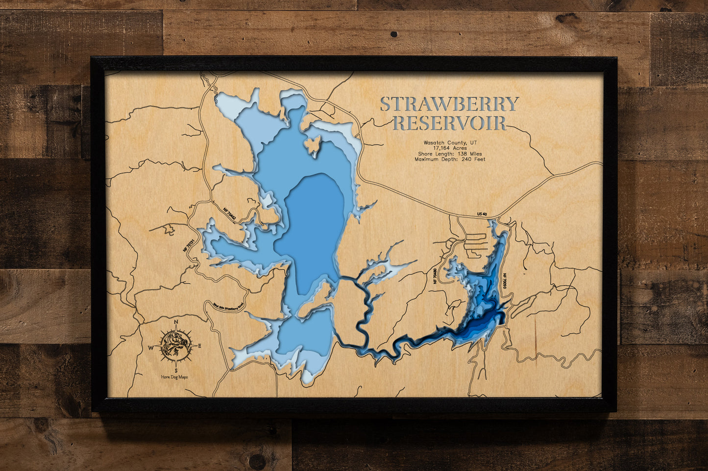 A meticulously detailed, laser-cut wooden topographic map of Strawberry Reservoir in Wasatch County, Utah, featuring multiple layers illustrating the reservoir's four distinct fishing basins across 17,164 acres, depth contours revealing the dramatic 240-foot maximum depth in Soldier Creek Basin, the intricate 138-mile shoreline winding through sagebrush hills and aspen valleys, markers for the four marina complexes and boat launches, Soldier Creek Dam, the Narrows section, and the surrounding Uinta-Wasatch-