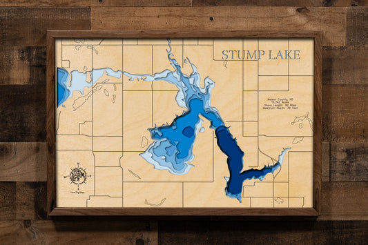A highly detailed, laser-cut, and multi-layered wooden map of Stump Lake, a natural lake in Nelson County, North Dakota. The map shows the lake's distinct, sprawling shape and its 91.4-mile shoreline, along with depth contours reaching a maximum of 77.1 feet. The map highlights the unique, flooded bays and the general area near Stump Lake Park.