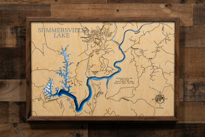 A precision laser-cut, multi-layered wooden map of Summersville Lake in Nicholas County, West Virginia — the state's largest and clearest lake. The natural wood top layer captures 60 miles of cliff-lined shoreline in fine detail, while a light-to-dark blue gradient highlights the lake's striking depth of 327 feet. A stunning, rustic statement piece for any Appalachian cabin, mountain retreat, or outdoor enthusiast's home.