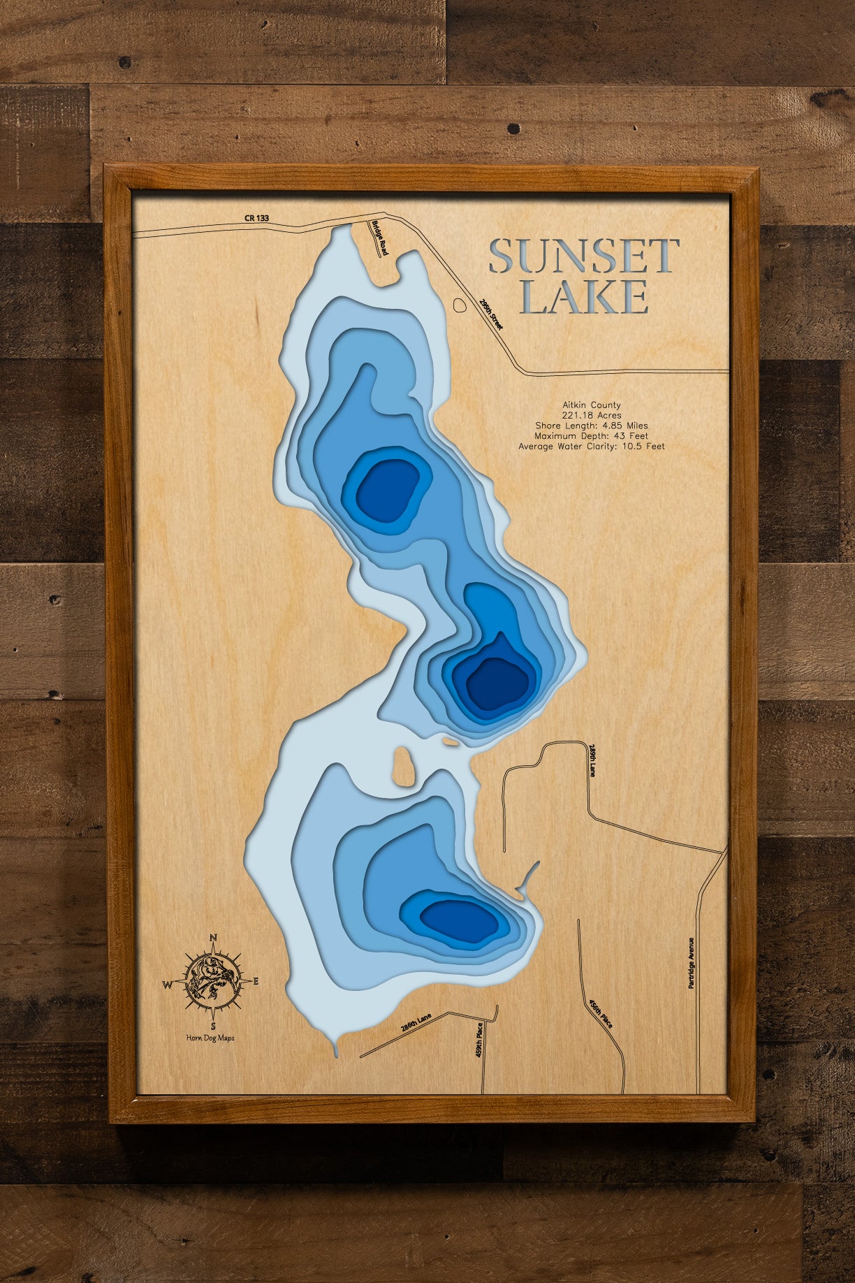 Artisanally carved wooden lake map of Sunset Lake in Aitkin County, MN, highlighting bathymetry.