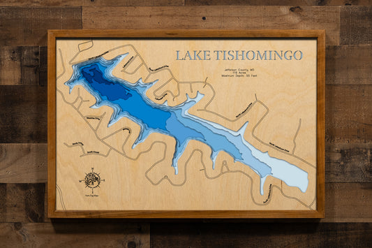 A precision laser-cut, multi-layered wooden map of Lake Tishomingo in Hillsboro, Jefferson County, Missouri. The natural wood top layer captures the shoreline of this historic 1948 private lake community in fine detail, while a light-to-dark blue gradient brings its calm, healing waters to life. A handcrafted statement piece for any Missouri lake home, cabin, or outdoor enthusiast's wall.