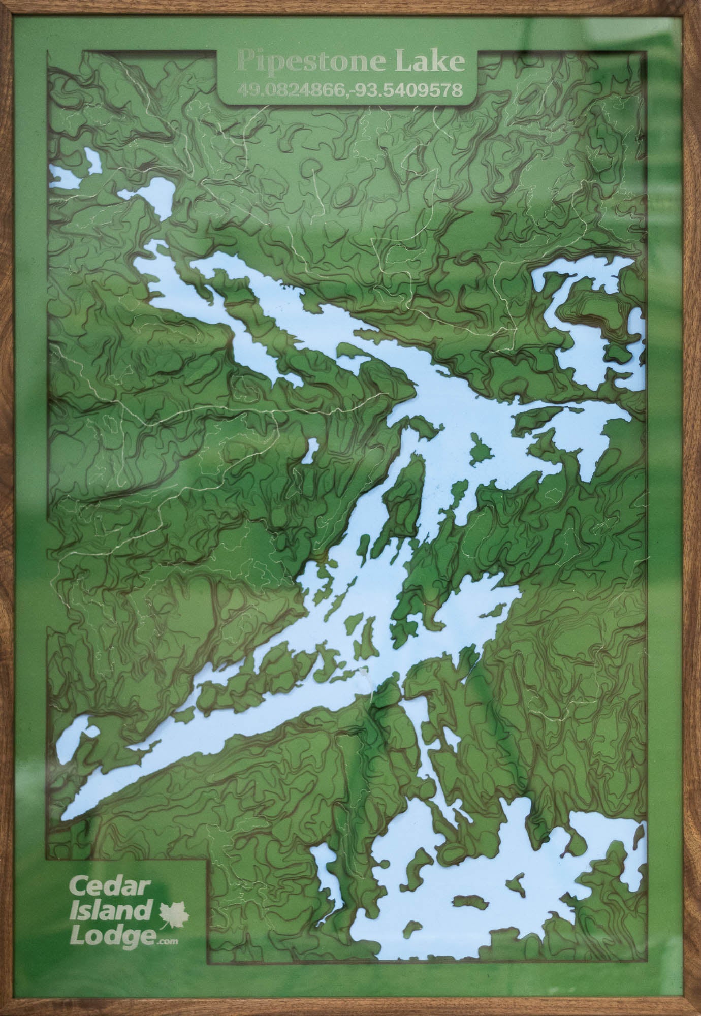 Topographical map of Pipestone Lake in Ontatio Canada. Also has Cedar Island Lodge Logo